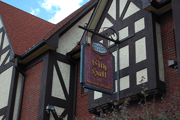 City Hall sign on the front of City Hall in the Tudor Village